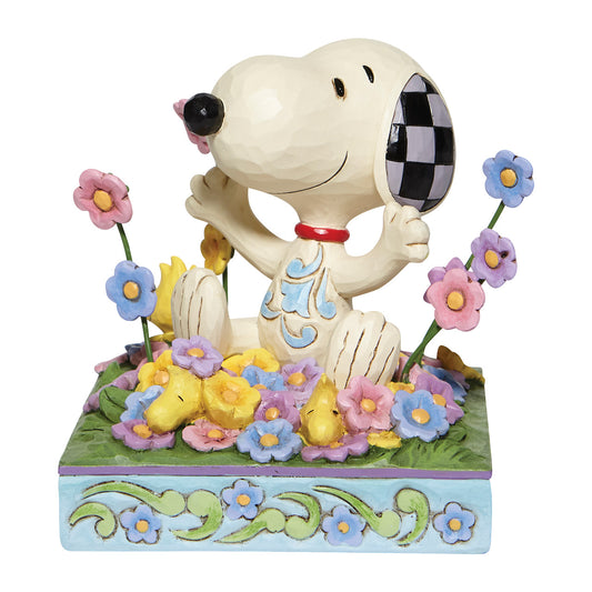 Bouncing into Spring? (Snoopy in bed of Flowers)?